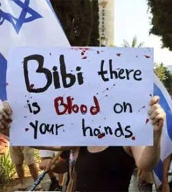 Israeli woman holding protest sign, "Bibi, there is blood on your hands"
