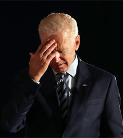 Joe Biden holding his head