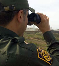 Border Patrol agent with binoculars