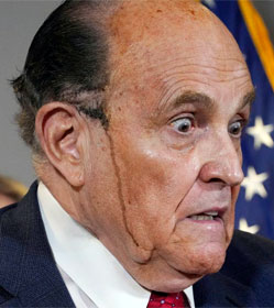 Rudy Giuliani with black hair dye streaming down his cheek