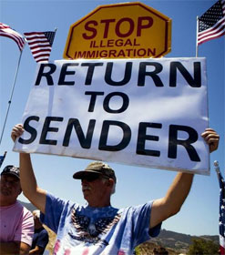 Man holding sign "Return to Sender"