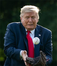 Donald Trump trying to catch a ball