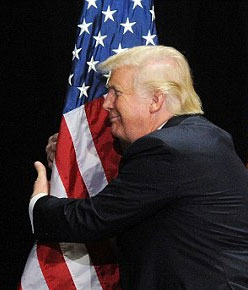 Donald Trump hugging American flag