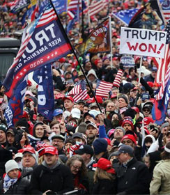 Crowd displaying Trump flags and "Trump won!" sign
