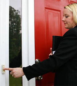 Woman ringing doorbell