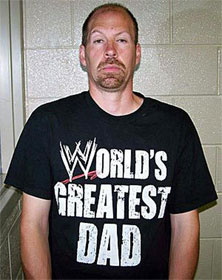 Man in "World's Greatest Dad" t-shirt