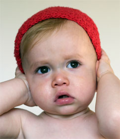 Baby covering ears
