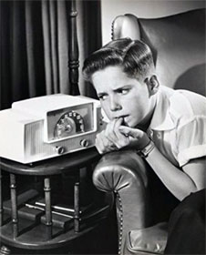 Boy listening nervously to radio