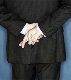 Man crossing his fingers behind his back