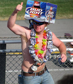 Man wearing Bud Lite carton as hat and empty beer cans as necklace