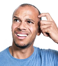 Man scratching head