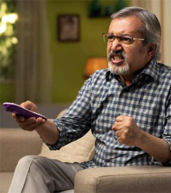 Angry man watching TV