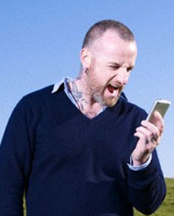 Man yelling at his cell phone