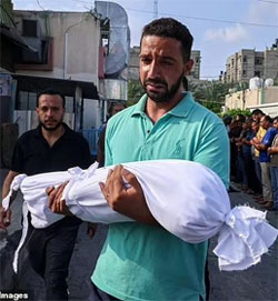 Gazan man carrying dead child