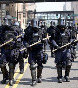 Police advancing in riot gear