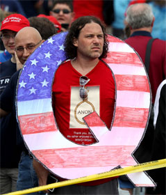 Man wearing a giant Q for QAnon