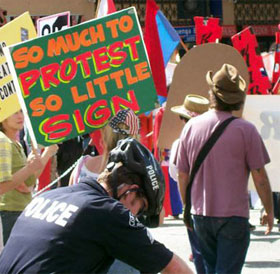 "So much to protest" sign