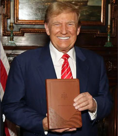Donald Trump holding "God Bless the USA Bible"