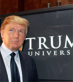 Donald Trump in front of Trump University sign