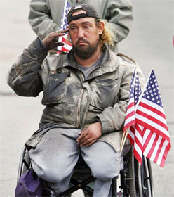 Veteran in wheelchair saluting flag
