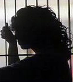 Woman behind bars