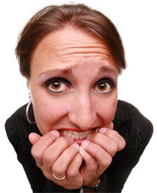 Woman biting her fingernails