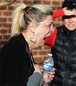 Woman crying at Arapahoe High School after shooting there