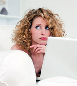 Worried gal at laptop